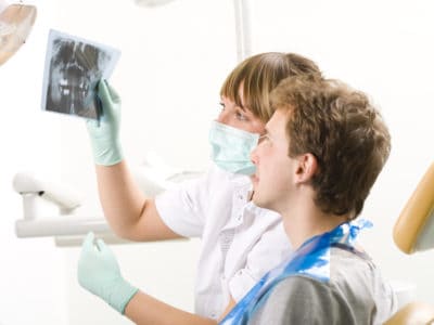 Dentist treating patient in Branford CT